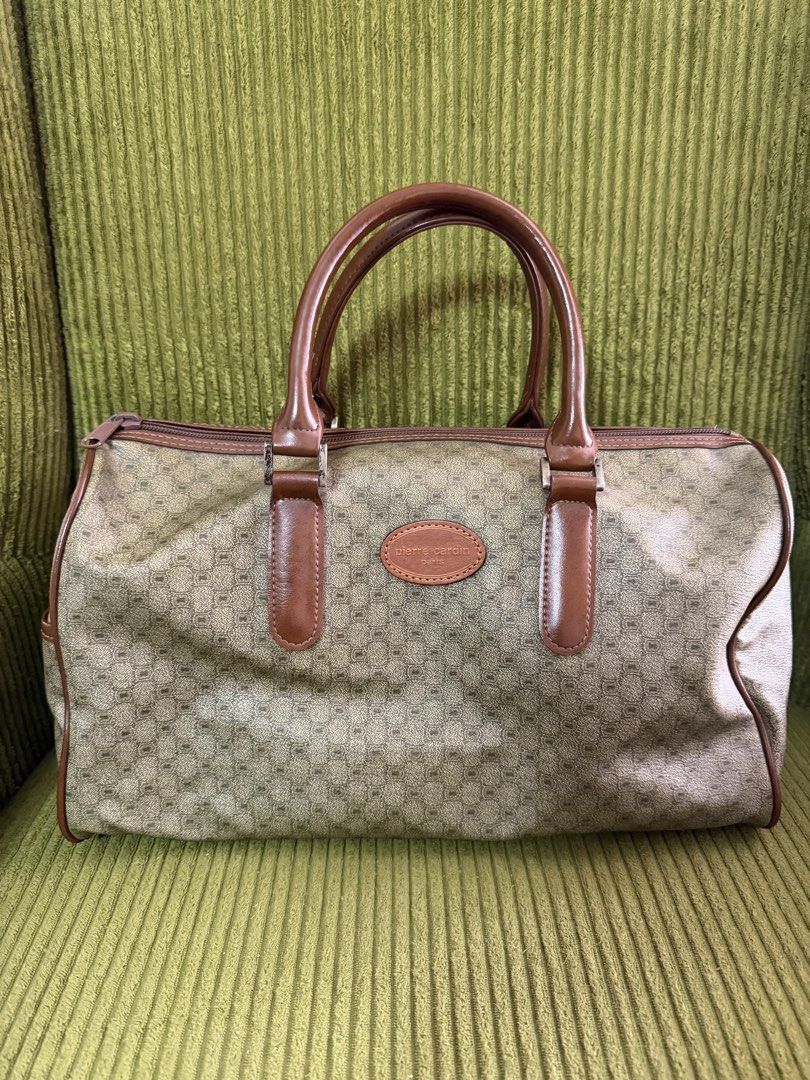Pierre Cardin Paris Monogram Doctor Bag (Category: Luxury Bags & Wallets) located in Manila. Submitted by lovelystuffmaycomeandgo (Listing ID 1459339359, Image 1). Description: - Vintage Pierre Cardin doctor’s bag - Classic monogram print - Brown leather trim and handles - Zipper closure - Ideal for weekend trips or carry-on - Minor wear on bottom corners and leather trim, consistent with age Length 14 in Width 6 in Height 8 in Handle 5 in dropdo