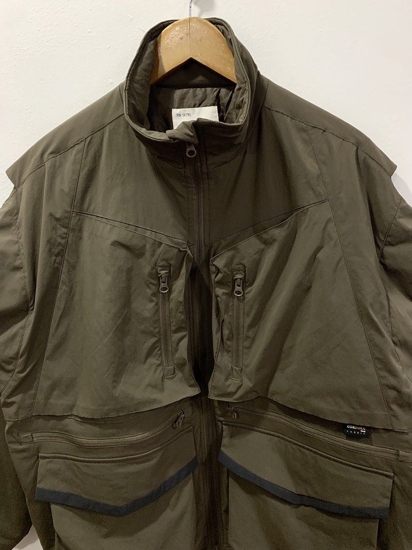 PIN SKTBS CORDURA TACTICAL MULTIPOCKET JACKET (Category: Coats, Jackets and Outerwear) located in Cavite. Submitted by ___layern0ne (Listing ID 1459473956, Image 2). Description: About the product: It is an outdoor-focused utility jacket designed with a distinctive multi-pocket gorpcore layout, heavy-duty Cordura advanced fabric trim, vertical zip chest compartments, and layered expanding cargo pocket Tagged Size: S (oversized) Armpit to Armpit (