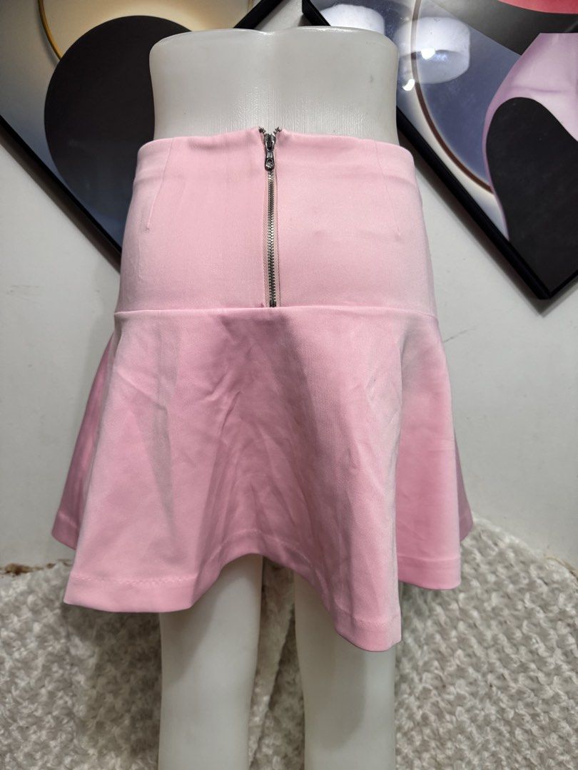Pink Flared Skirt with Zipper Back (Category: Skirts) located in Marikina City. Submitted by lorradel (Listing ID 1459440141, Image 3). Description: - w:26in L:15.5in - Adorable pink flared skirt - Flattering high-waisted design - Convenient back zipper closure - Fabric with a subtle texture - Versatile for casual or dressy occasions - Effortlessly pairs with various tops.