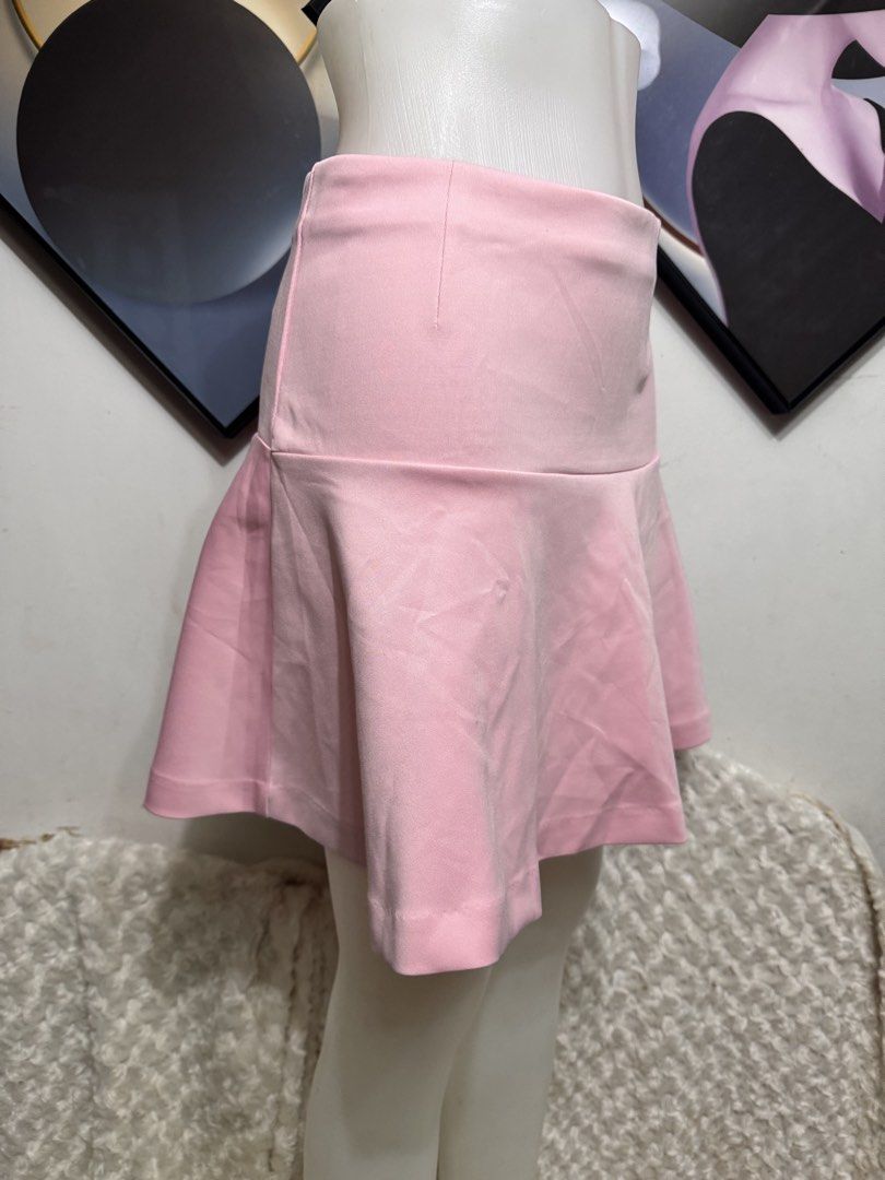 Pink Flared Skirt with Zipper Back (Category: Skirts) located in Marikina City. Submitted by lorradel (Listing ID 1459440141, Image 2). Description: - w:26in L:15.5in - Adorable pink flared skirt - Flattering high-waisted design - Convenient back zipper closure - Fabric with a subtle texture - Versatile for casual or dressy occasions - Effortlessly pairs with various tops.