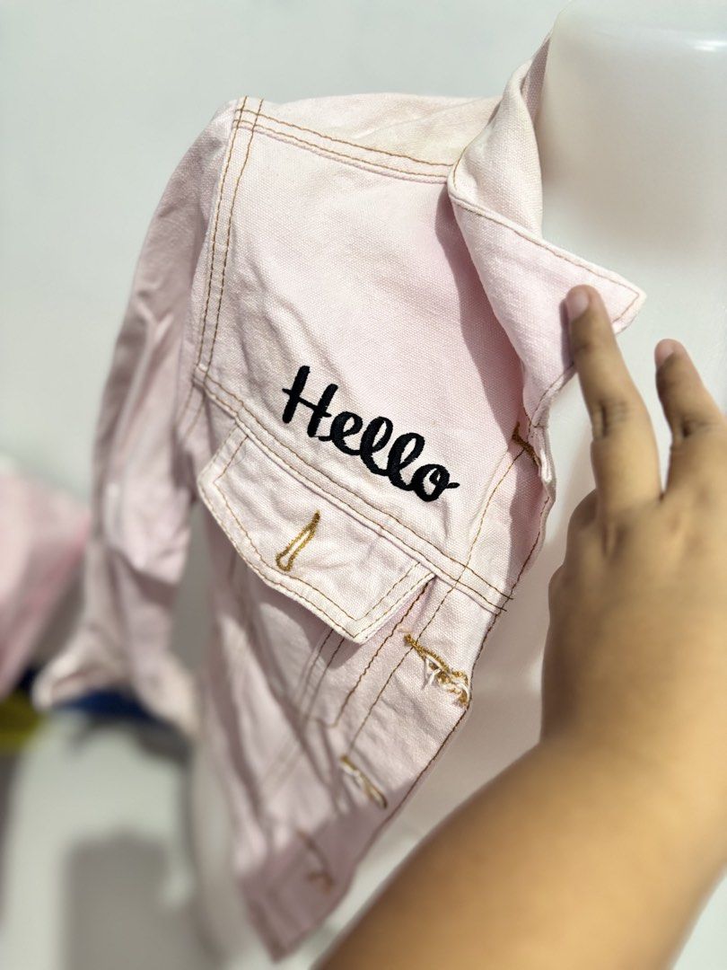 Pink Hello Kitty Denim Jacket (Category: Coats, Jackets and Outerwear) located in Valenzuela. Submitted by hellokittyjunkie (Listing ID 1459475970, Image 3). Description: - Cute pink denim jacket - Features a large Kitty graphic on the back - '' and 'Kitty' embroidered on the front - Button closure for easy wear - Ideal for casual outfits - A must-have for any Kitty enthusiast!.