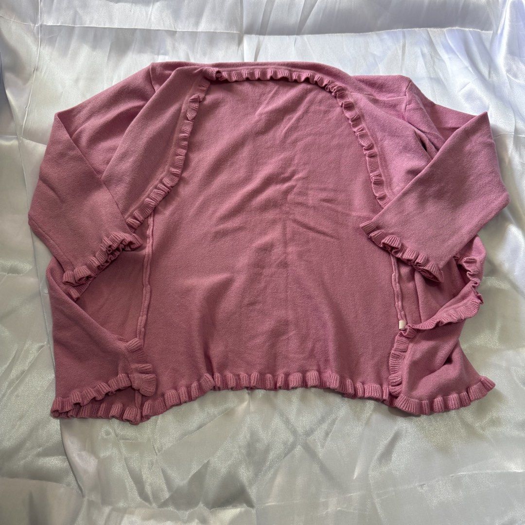 Pink Ruffle Trim Cardigan (Category: Coats, Jackets and Outerwear) located in Taguig. Submitted by kcxkyucartz (Listing ID 1459314834, Image 2). Description: 🎀 Pink Ruffle Trim Cardigan Condition: 9/10 - Size: can fit up to M - Mom’s personal fave, perf for baguio trip - Price is nego need lang talaga magrebrand closet :d ₱150 rfs: decluttering.