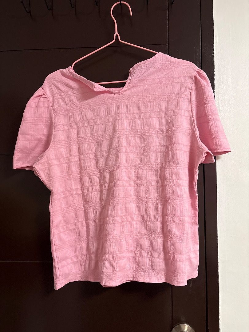 Pink Textured Puff Sleeve Top (Category: Blouses) located in Caloocan City. Submitted by dimple.19 (Listing ID 1459412285, Image 1). Description: NAWALA PO ANG BUTTON SA LIKOD :( - Adorable pink top with a unique textured pattern. - Features cute short puff sleeves. - Stylish collar detail adds a touch of charm. - Versatile for casual outings or dressing up. - Effortlessly pairs with jeans, skirts, or shorts. - Comfortable and fashionable for eve