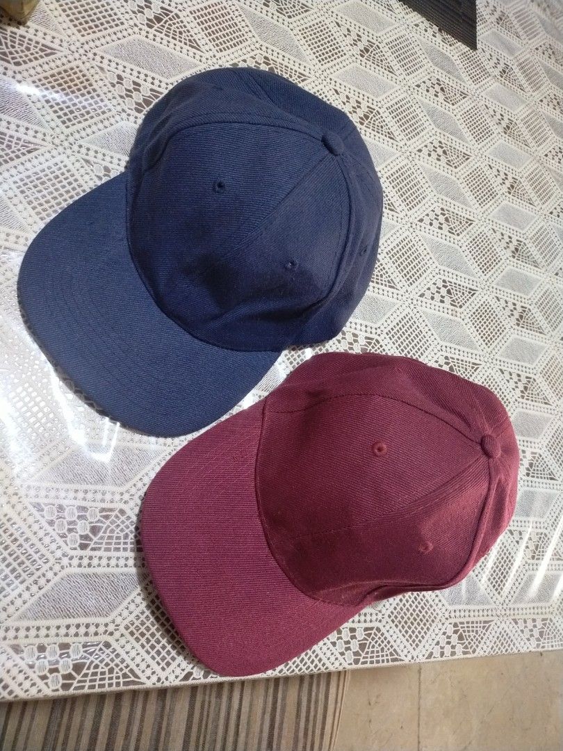 Plain Solid-Color Cap Set – Navy & Maroon (2 Pieces) (Category: Caps & Hats) located in Paranaque City. Submitted by gentle.declutter (Listing ID 1456096910, Image 3). Description: - Set of 2 classic caps: Deep navy blue + rich maroon/red — matching simple, clean design - Style: Soft unstructured crown, curved brim, 6-panel, metal eyelets — timeless everyday silhouette - Material: Smooth durable cotton twill — lightweight, breathable, comfortable