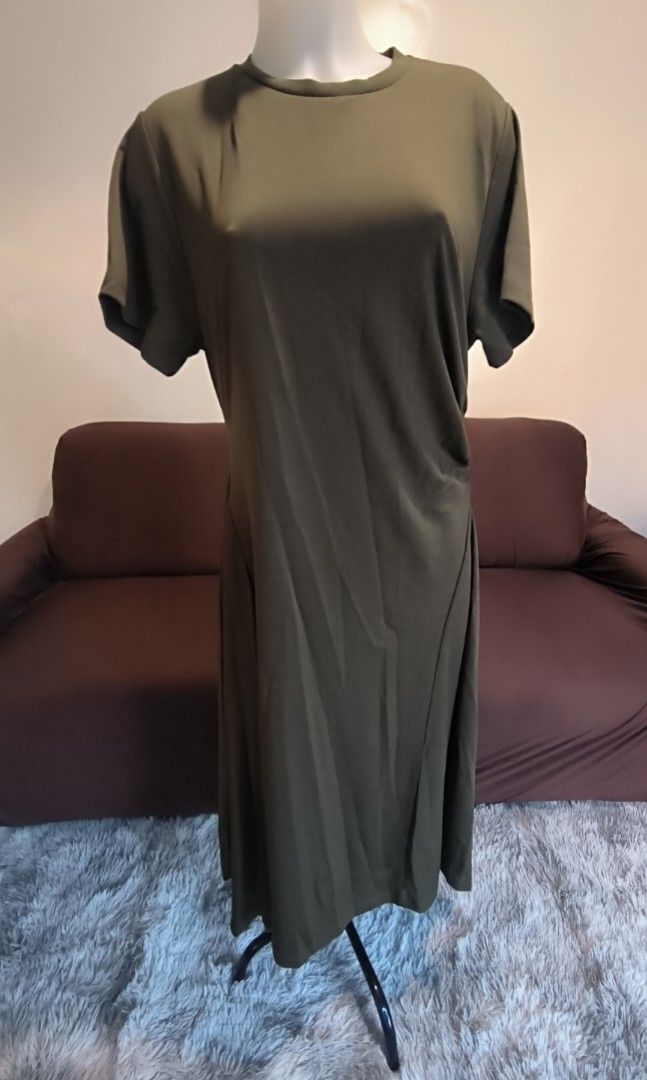 Plains & Prints Olive Green Dress (Category: Dresses) located in Antipolo. Submitted by secondcharmstore (Listing ID 1430887978, Image 1). Description: -sale 900 Olive green dress from Plains & Prints. Features a round neckline and short sleeves. The dress has a ruched detail on one side and a pleated design on the other side. The dress falls to a midi length. The tag indicates a size of UK 16 and US 12. original price P2598 no tag, never worn ch