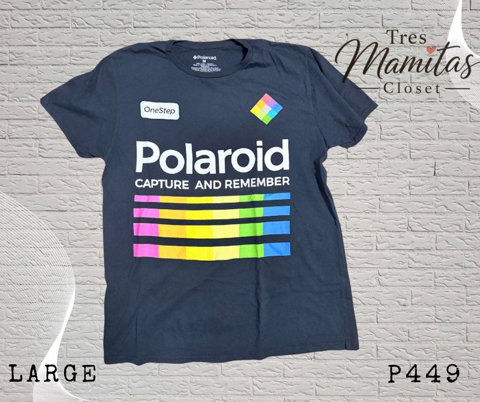 Polaroid Capture and Remember T-shirt (Category: Tshirts & Polo Shirts ) located in Manila. Submitted by activemommathrifter (Listing ID 1459343172, Image 1). Description: - Black t-shirt with iconic Polaroid logo - Features colorful stripes - 'Capture and Remember' slogan on the front - Ideal for photography lovers - Size: Large.