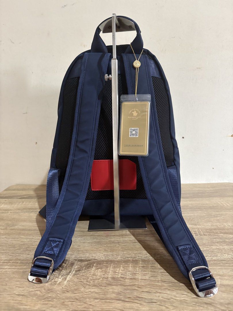 Polo backpack (Category: Backpacks) located in Pototan. Submitted by tres_190725 (Listing ID 1459434627, Image 2). Description: navy blue Santa Barbara Polo & Racquet Club nylon backpack with a front zippered pocket and distinct red and white branding..