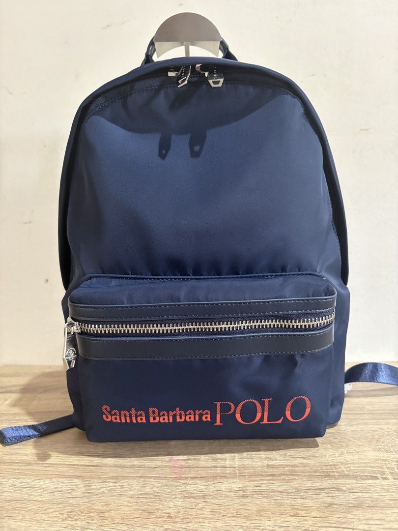 Polo backpack (Category: Backpacks) located in Pototan. Submitted by tres_190725 (Listing ID 1459434627, Image 1). Description: navy blue Santa Barbara Polo & Racquet Club nylon backpack with a front zippered pocket and distinct red and white branding..