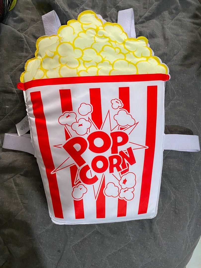 Popcorn Bucket Costume Backpack (Category: Babies & Kids Fashion) located in Cagayan de Oro. Submitted by sethmarko27 (Listing ID 1459433073, Image 1). Description: - Unique popcorn bucket backpack design - Ideal for parties, dress-up, or everyday fun - Adjustable straps for a comfortable fit - Plain white interior - Fun accessory for kids and adults alike.