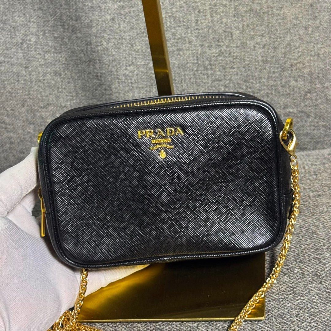 PRADA CAMERA BAG MINI (Category: Luxury Bags & Wallets) located in Claveria. Submitted by jhunaceeeeee (Listing ID 1459318129, Image 1). Description: 💯Authentic Replace Chain Sling Pwedi ko samahan leather sling With dustbag No issue.