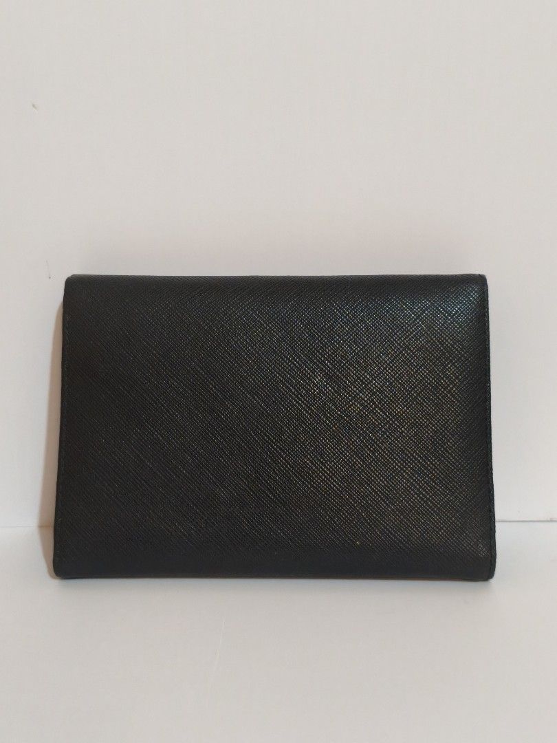 Prada long wallet (Category: Luxury Bags & Wallets) located in Bayombong. Submitted by ecec1992 (Listing ID 1459300513, Image 3). Description: prada authentic good as new sana kaso may rip konti sa gilid not noticeable naman.