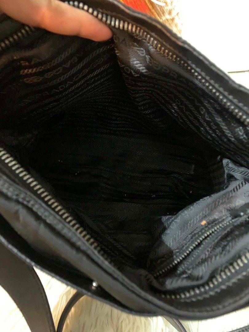 Prada Nylon sling bag (Category: Luxury Bags & Wallets) located in Iloilo. Submitted by jananapad (Listing ID 1459413610, Image 3). Description: Well used GUARANTEED ORIGINAL no inclusion #10.