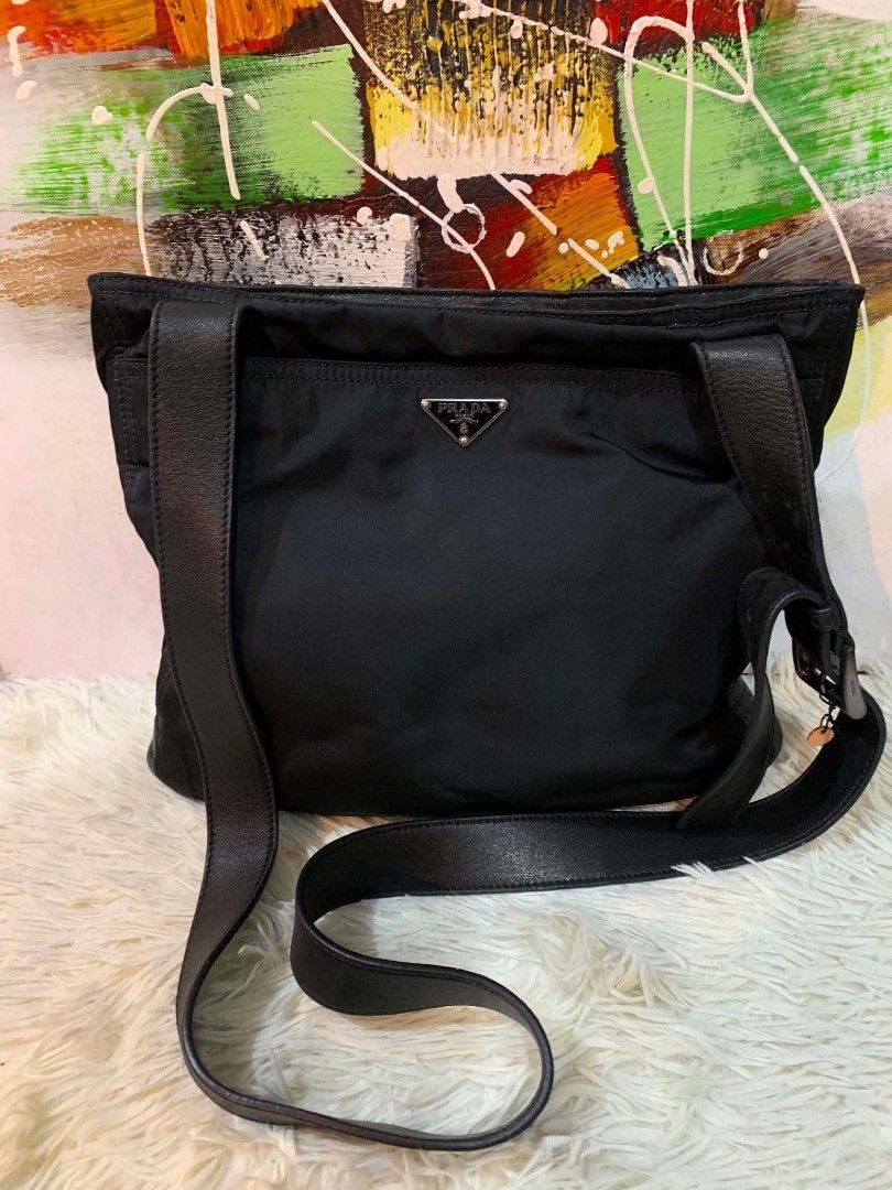 Prada Nylon sling bag (Category: Luxury Bags & Wallets) located in Iloilo. Submitted by jananapad (Listing ID 1459413610, Image 1). Description: Well used GUARANTEED ORIGINAL no inclusion #10.
