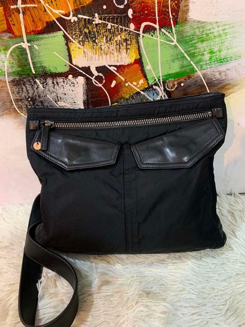 Prada Nylon sling bag (Category: Luxury Bags & Wallets) located in Iloilo. Submitted by jananapad (Listing ID 1459413610, Image 2). Description: Well used GUARANTEED ORIGINAL no inclusion #10.