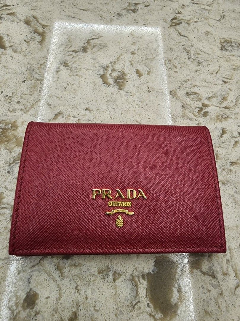 Prada Saffiano Leather Card Holder Red (Category: Luxury Bags & Wallets) located in Manila. Submitted by wardrobemanila (Listing ID 1459414369, Image 1). Description: bought this abroad pangit lang quality photo ko dahil sa ilaw pero maganda pa ito, msg nyo nlng ako for more photo, also galing na ito sa the bag Hub ksi pina consign ko ito before sakanila. May photos na rin sila nito before ,nacheck nila and na authenticate na. And sure naman orig