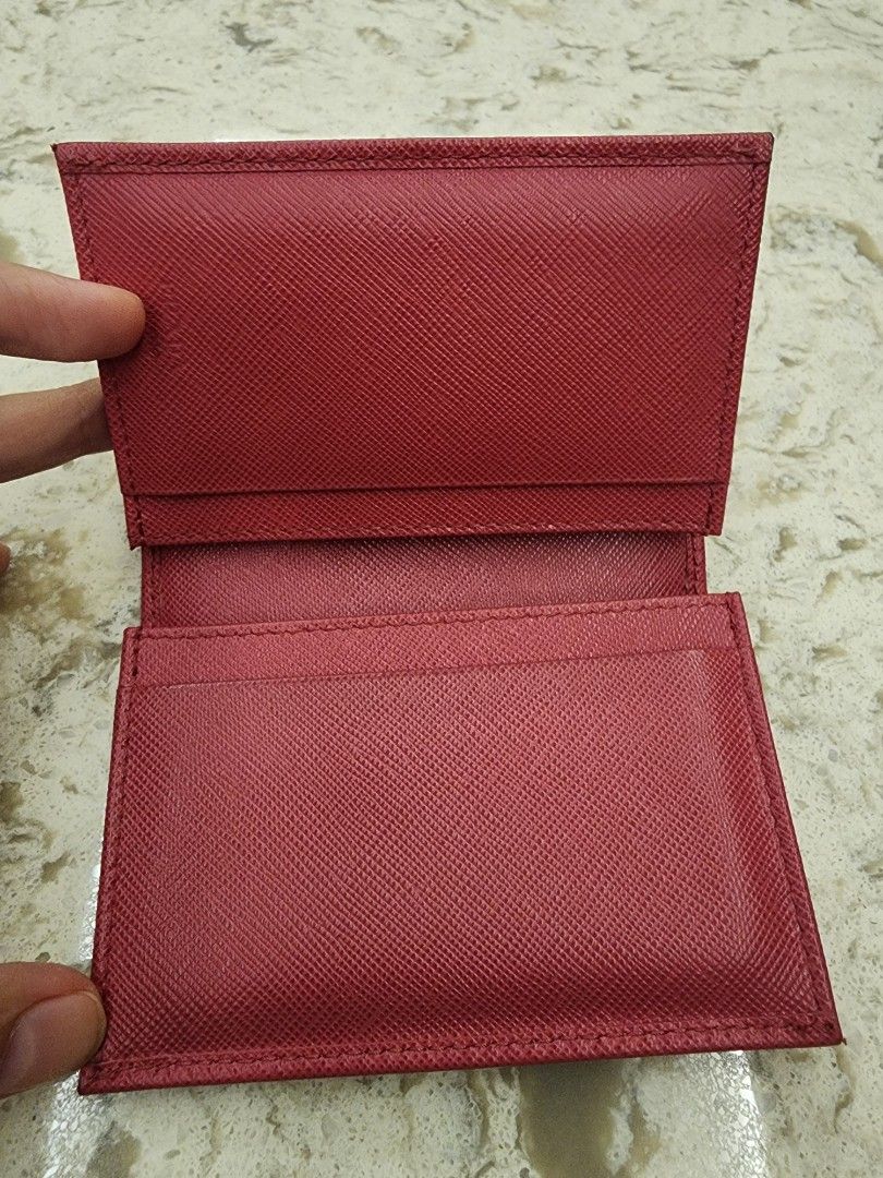 Prada Saffiano Leather Card Holder Red (Category: Luxury Bags & Wallets) located in Manila. Submitted by wardrobemanila (Listing ID 1459414369, Image 3). Description: bought this abroad pangit lang quality photo ko dahil sa ilaw pero maganda pa ito, msg nyo nlng ako for more photo, also galing na ito sa the bag Hub ksi pina consign ko ito before sakanila. May photos na rin sila nito before ,nacheck nila and na authenticate na. And sure naman orig