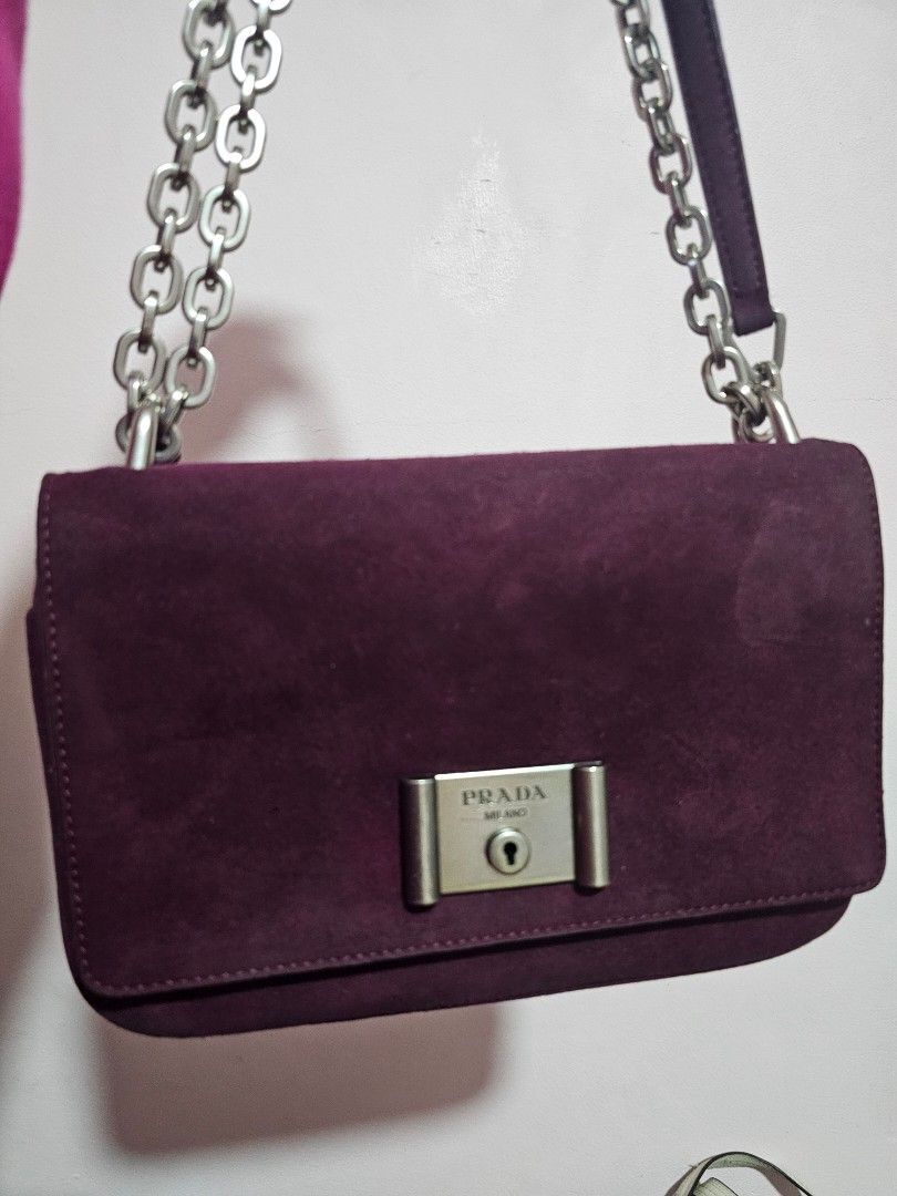 Prada suede purple bag (Category: Luxury Bags & Wallets) located in Angeles City. Submitted by kodachi10 (Listing ID 1459337174, Image 1). Description: suede purple bag with signs of use thick leather zipper puller broke off inside but bag pocket still zips lampo underzip self authenticate with this item.