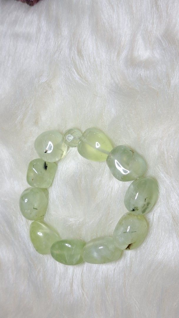 Prehnite Smooth Nugget Bracelet (Category: Bracelets) located in Quezon City. Submitted by crystallinehaven (Listing ID 1459353921, Image 1). Description: - Genuine Prehnite nugget bracelet ♦️p1 only ♦️p880 - Smooth, tumbled stones with translucent green color - Unique natural inclusions in each bead - Stretchy elastic for comfortable wear - Versatile for everyday or special occasions - A beautiful addition to any crystal collection 💥READ FIRST 