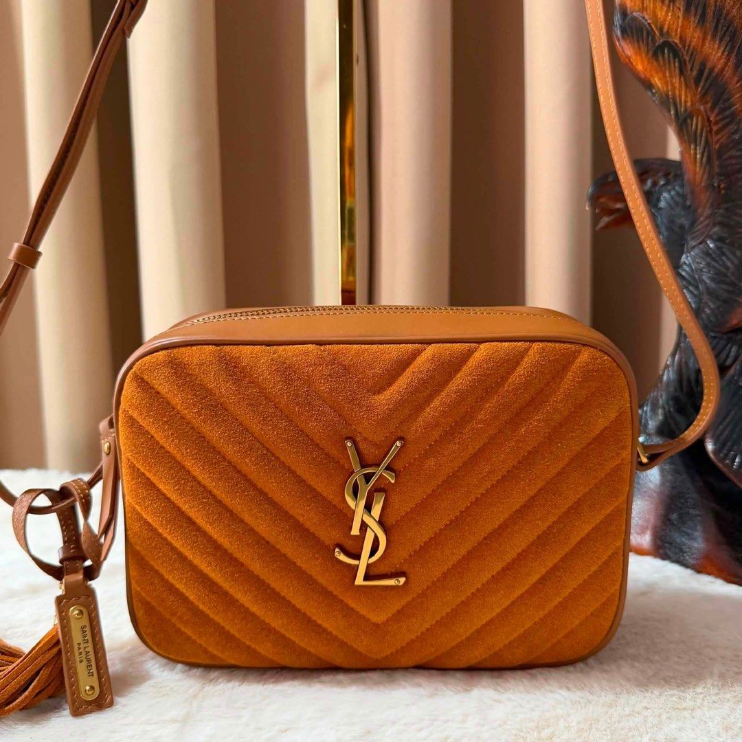 Preloved Ysl Black Chevron Leather Camera Bag (Category: Luxury Bags & Wallets) located in Manila. Submitted by bagsandmanymanymore1 (Listing ID 1457728401, Image 1). Description: - Preloved Loulou Ysl black leather camera bag -size 22cm - Iconic YSL logo and chevron quilting - Includes original dust bag and box - Features a stylish tassel zipper detail - Made in Italy - Perfect for everyday use.