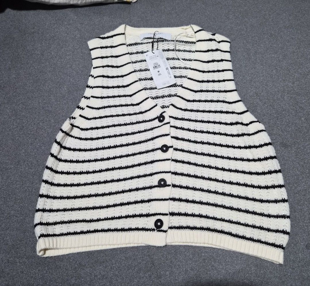 Primark Striped Knit Vest (Category: Sleeveless) located in Taguig. Submitted by chloe_clothingco. (Listing ID 1459392848, Image 1). Description: - Cream and black striped knit vest avail size: small & Med - Button-up front with black buttons - Sleeveless design - Ideal for layering over tops or dresses - Brand new with tags attached.