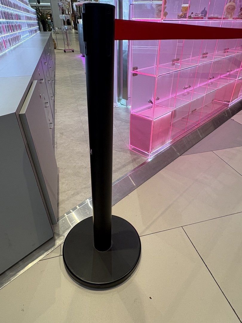 Queue Barrier Pole (Category: Other Security Devices) located in Singapore. Submitted by stylecove (Listing ID 1459347885, Image 2). Description: - 4 black queue barrier poles - Includes retractable red belts for crowd management - Sturdy and stable design - Suitable for events, retail, or any queuing needs - look as good as new - Price listed is one piece. - Self collect after 13th Sept. .