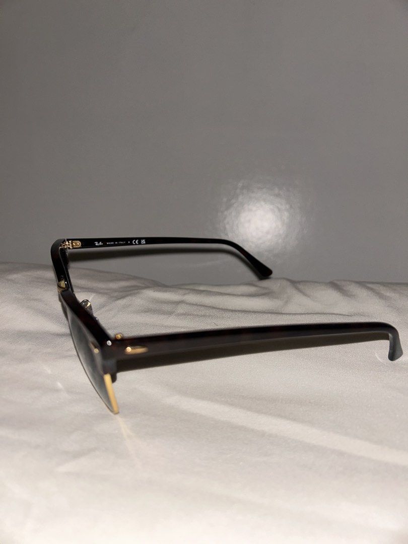 Ray-Ban Clubmaster Sunglasses Tortoise Shell (Category: Sunglasses & Eyewear) located in Cebu City. Submitted by tamsherika (Listing ID 1459472598, Image 2). Description: - Classic Ray-Ban Clubmaster sunglasses - Tortoise shell frame with gold accents - Dark green lenses - Made in Italy - Original Ray-Ban case included - Timeless and great for everyday wear.