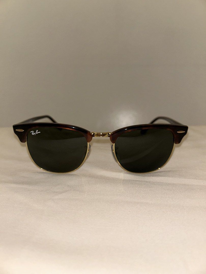 Ray-Ban Clubmaster Sunglasses Tortoise Shell (Category: Sunglasses & Eyewear) located in Cebu City. Submitted by tamsherika (Listing ID 1459472598, Image 3). Description: - Classic Ray-Ban Clubmaster sunglasses - Tortoise shell frame with gold accents - Dark green lenses - Made in Italy - Original Ray-Ban case included - Timeless and great for everyday wear.