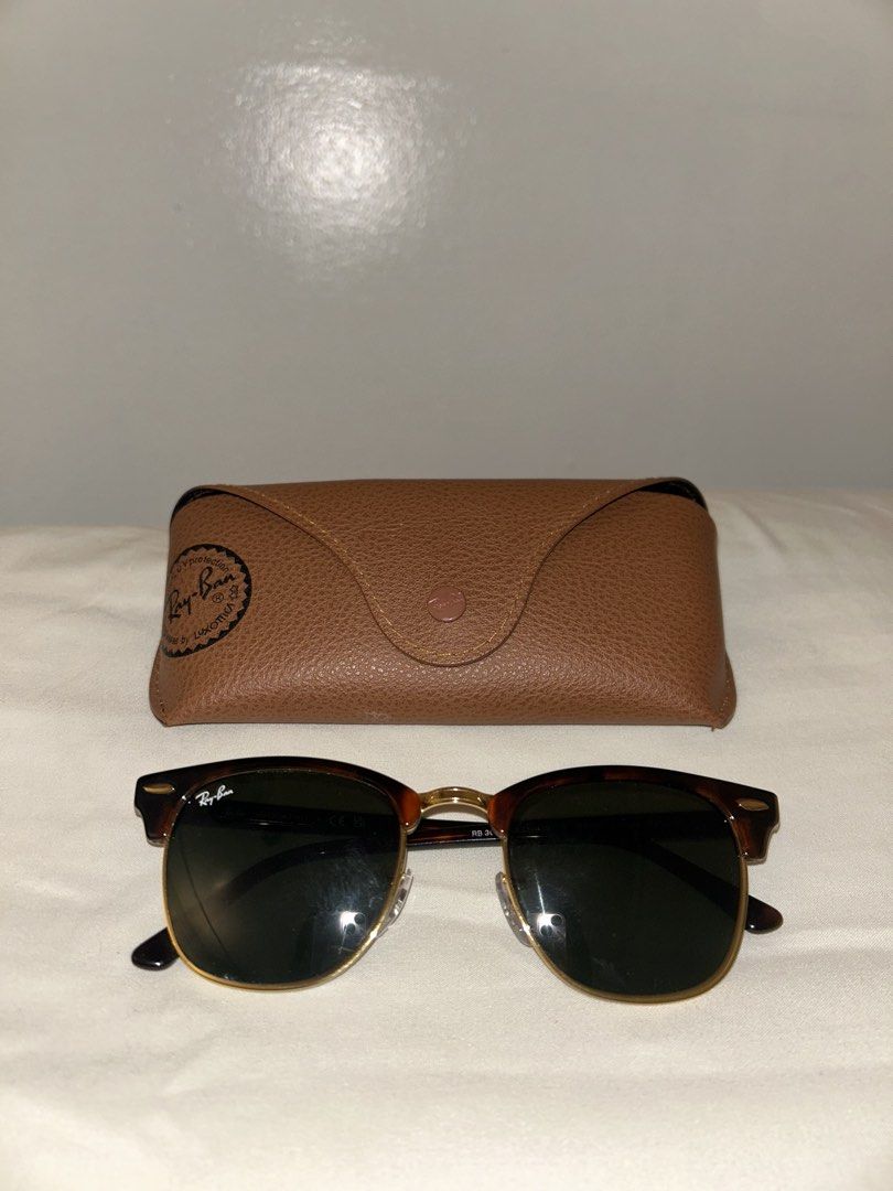 Ray-Ban Clubmaster Sunglasses Tortoise Shell (Category: Sunglasses & Eyewear) located in Cebu City. Submitted by tamsherika (Listing ID 1459472598, Image 1). Description: - Classic Ray-Ban Clubmaster sunglasses - Tortoise shell frame with gold accents - Dark green lenses - Made in Italy - Original Ray-Ban case included - Timeless and great for everyday wear.
