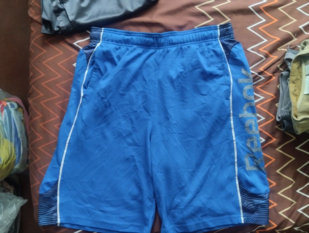 Reebok Blue Polyester Athletic Shorts Size L (Category: Shorts) located in Manila. Submitted by veotixfanaccount (Listing ID 1459399682, Image 2). Description: 💸300 + SF ❌Issue: No Issues Good Condition!! Dimes: Length - 22.5 Waist - 33/L Leg Opening - 14.