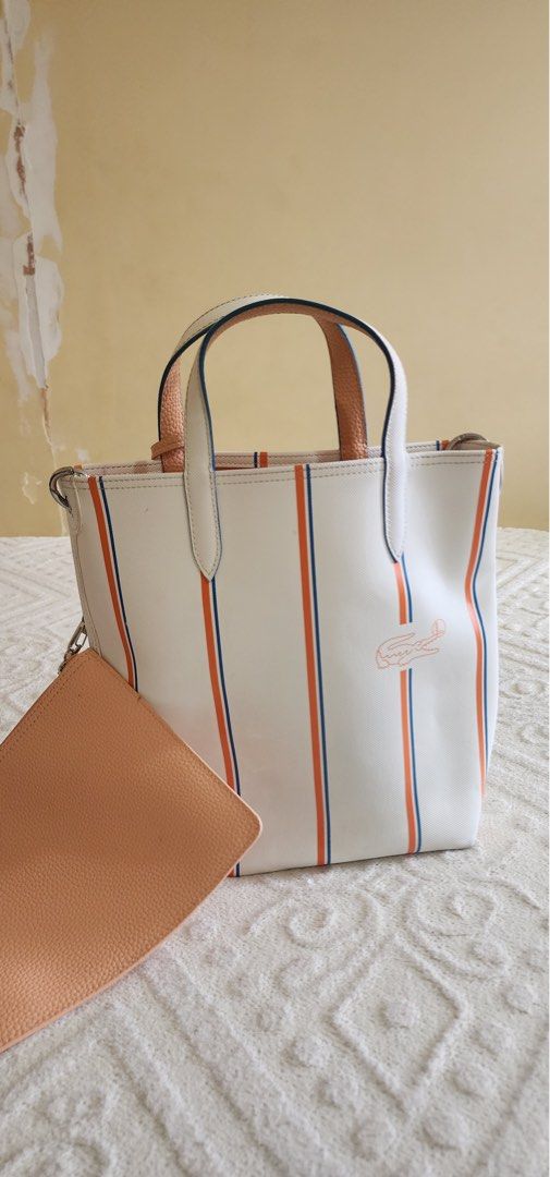 REVERSIBLE VERTICAL TOTE W POUCH (Category: Cross-body Bags) located in Dasmarinas. Submitted by khaym__ (Listing ID 1459371352, Image 1). Description: - REVERSIBLE DESIGN - ICONIC LACOSTE STYLE - COMES WITH MATCHING POUCH .