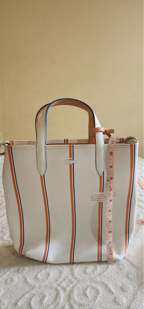 REVERSIBLE VERTICAL TOTE W POUCH (Category: Cross-body Bags) located in Dasmarinas. Submitted by khaym__ (Listing ID 1459371352, Image 2). Description: - REVERSIBLE DESIGN - ICONIC LACOSTE STYLE - COMES WITH MATCHING POUCH .