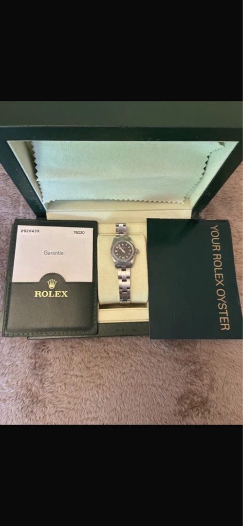 Rolex Oyster Watch with Box and Papers (Category: Luxury Watches) located in Manila. Submitted by trz5jh69sv95845 (Listing ID 1459425986, Image 1). Description: - Authentic Rolex Oyster watch - Includes original box and warranty card - Features a classic black dial - Stainless steel bracelet - All original documentation provided - Extra links included - Ideal for watch enthusiasts and collectors.