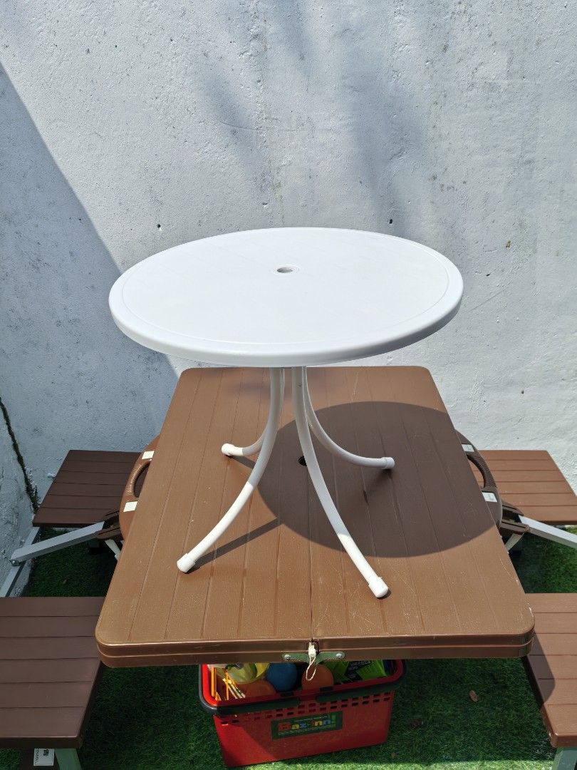 Round Bistro Patio Table (Category: Coffee & Tea Tableware) located in Cebu City. Submitted by dudes_villanueva (Listing ID 1459326422, Image 1). Description: Round Bistro Patio Table 📌 It features a weather-resistant molded plastic tabletop with a central umbrella hole and is supported by four curved metal legs reinforced by a central stabilizing column.Key 📌 Lightweight, all-weather polypropylene resin. 📌 Circular top with an umbrella plug, 