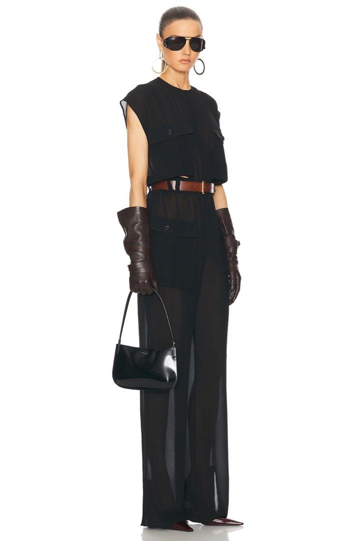SAINT LAURENT Black Handbag (Category: Luxury Bags & Wallets) located in Pasig City. Submitted by leblancxx (Listing ID 1459290033, Image 3). Description: The Saint Laurent Mini Flat shoulder bag is crafted in Italy from patent leather, with a suede lining. The shoulder bag features a top magnetic button closure, one main compartment, and an interior leather card slot. An integrated leather shoulder strap completes the design. Measures approximat