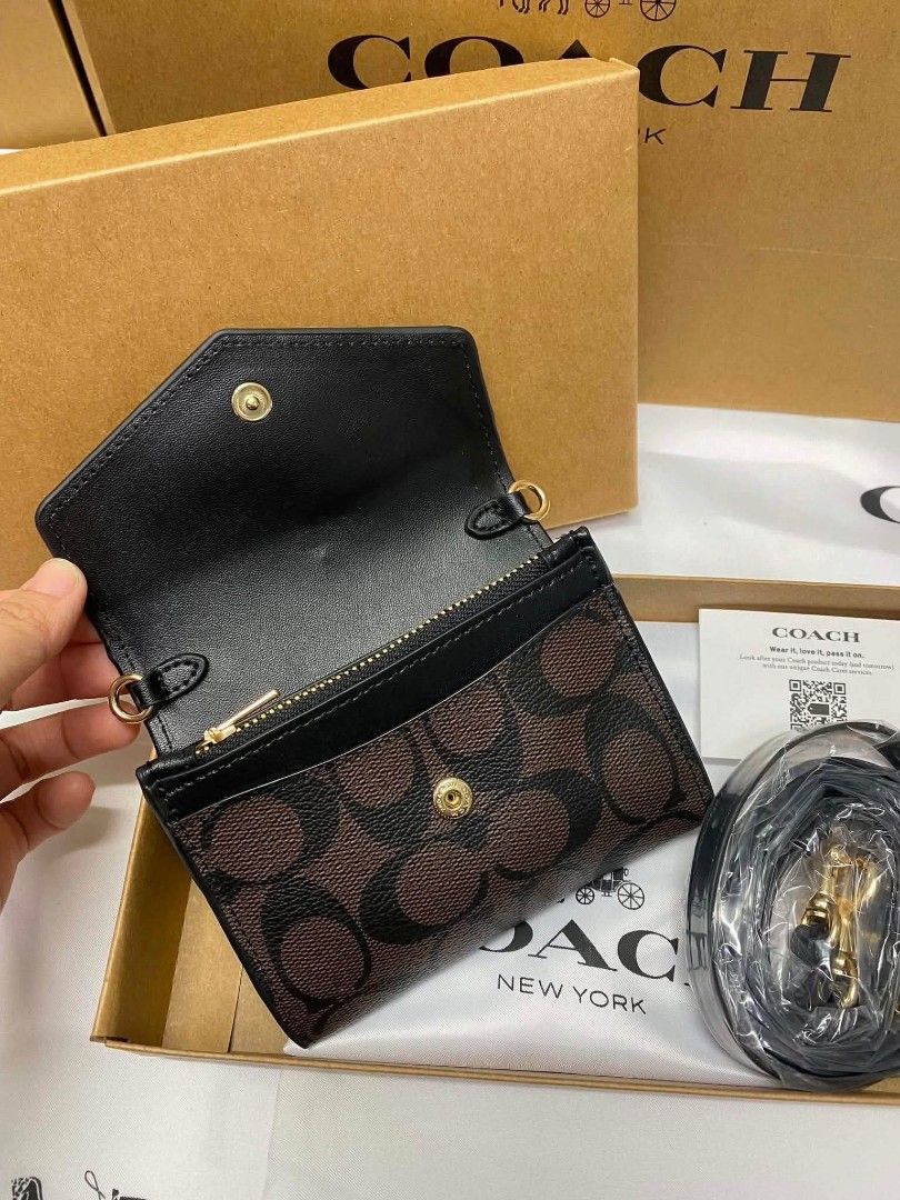 Sale! Coach Mini Envelope Wallet with strap sling (Category: Wallets & Card holders) located in Mandaluyong City. Submitted by priceles (Listing ID 1459418591, Image 2). Description: Brand New with inclusions Good for gifts and everyday Use NO COD.