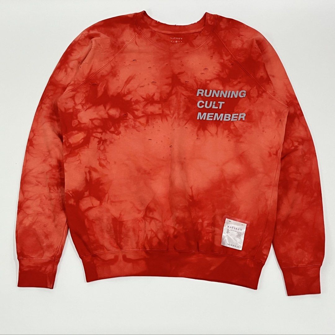 SATISFY - CULT MOTH EATEN CREW SWEATSHIRT (Category: Hoodies) located in Lucena. Submitted by southsidekartell (Listing ID 1459292357, Image 2). Description: Long sleeve cotton fleece sweatshirt in bleach red. Distressing and fading throughout. Rib knit crewneck collar, cuffs, and hem. Text printed in reflective silver-tone at chest. Detachable tag at hem. Concealed pocket at interior hem. Tonal stitching. SIZE 2 FITS MEDIUM NO MAJOR ISSUES COLOR