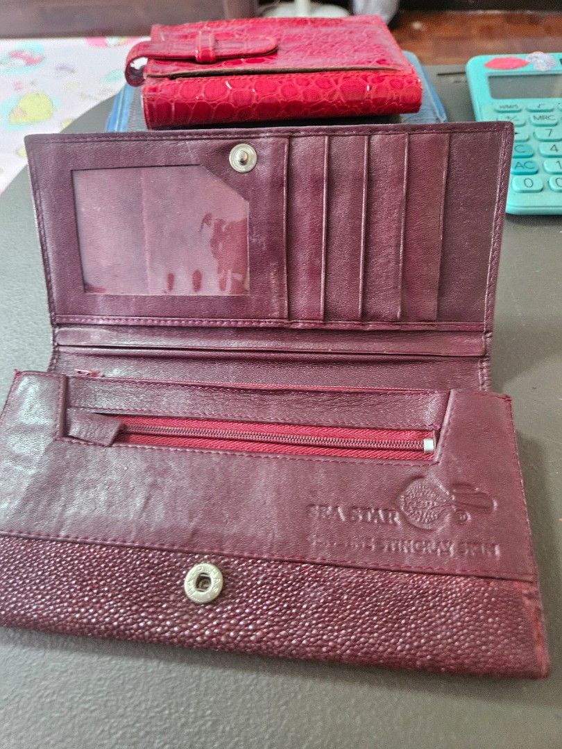 Sea Star Stingray Leather Wallet (Category: Wallets & Card holders) located in Manila. Submitted by hausofgadgetatbp (Listing ID 1459347531, Image 3). Description: - Genuine burgundy stingray leather wallet - Unique, textured stingray skin - Secure snap closure - Multiple card slots for easy organization - Interior zippered compartment for added security - Perfect for keeping your essentials tidy.