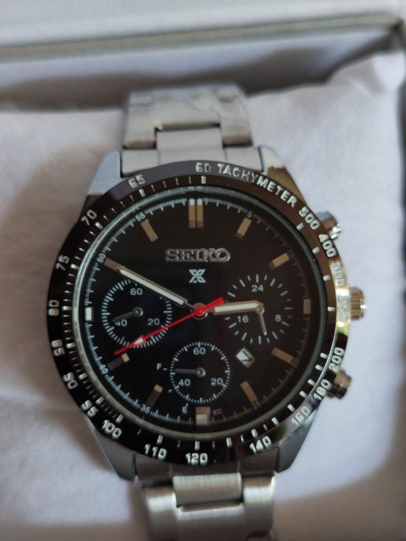 Seiko Chronograph Tachymeter Watch (Category: Men's Watches) located in Mangaldan. Submitted by michelle_2004 (Listing ID 1459373020, Image 2). Description: - Seiko Chronograph Watch - Sleek Black Dial - Functional Tachymeter Bezel - Durable Stainless Steel Band - Includes Original Box - Versatile for daily wear or special events.