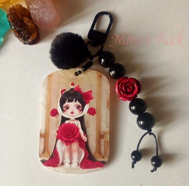 SKULLPANDA ROSE GEMSTONE KEYCHAIN/ BAG CHARM (Category: Charms) located in Taguig. Submitted by mimisrack (Listing ID 1459479609, Image 1). Description: 🖤Add a bold elegant collector-core vibe to your bags and keys with this handcrafted Skullpanda-inspired keychain featuring glossy black gemstone beads and dramatic rose details Perfect for Skullpanda collectors, dark coquette lovers, and statement accessory fans! -Dark romantic aesthetic -Perfec