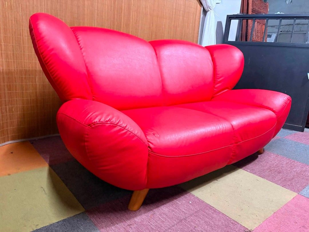 Sofa (Category: Sofas) located in Meycauayan. Submitted by marygracecasimiro (Listing ID 1459341142, Image 3). Description: 😍PWEDE PANG STUDIO!!! BONGGA!!! Stylish Vibrant Red Leather Loveseat Curved Side Bolsters & Flared Backrest 2 to 3-Seater Sofa, ANGGANDA!!! SUPER SOFT AND COMFY!!! Price : 15k ✅ Now:11,000💚 *SEE VIDEO COMMENT 69L x 40W x 15H seat height inches Sandalan height 32 inches In VERY good condition ♥️.