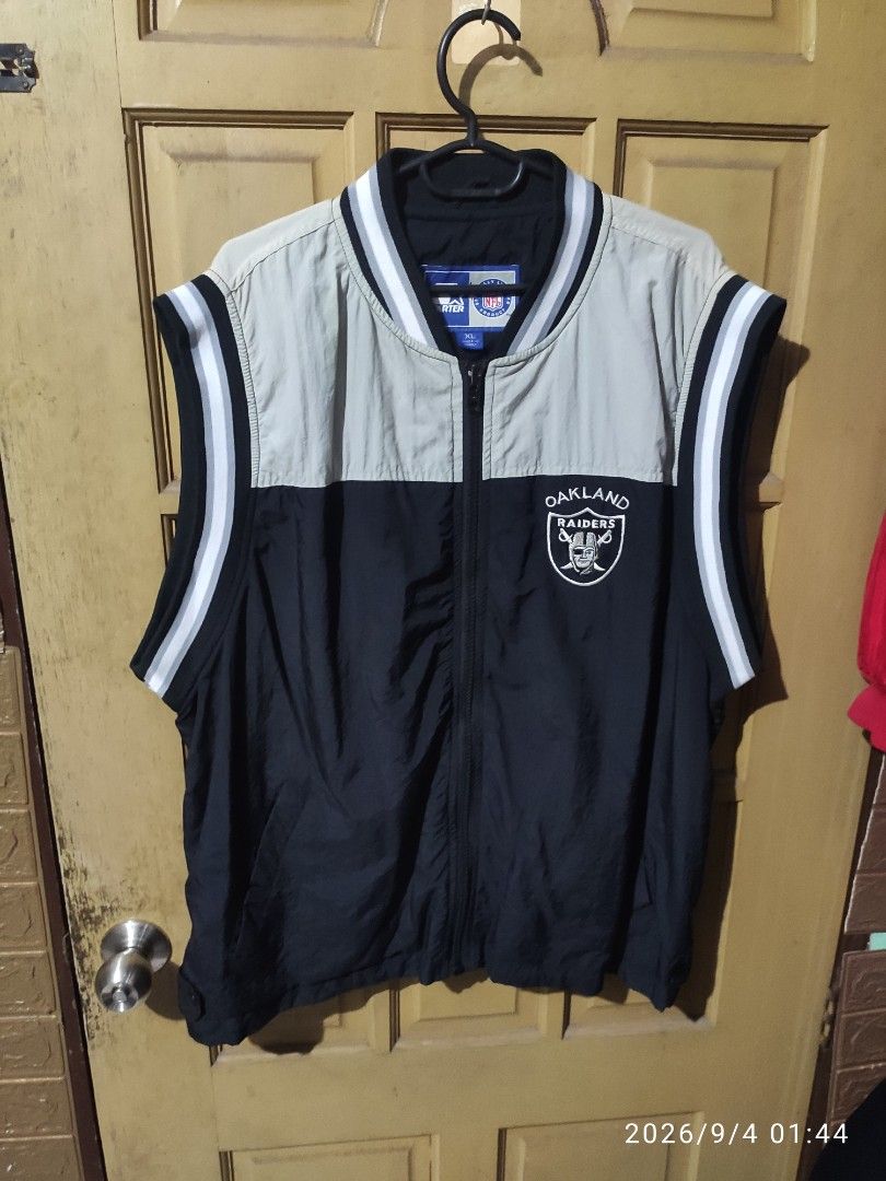Starter Oakland Raiders NFL Jacket XL (Category: Coats, Jackets and Outerwear) located in Las Pinas. Submitted by vtg_sakalam2021 (Listing ID 1459465002, Image 1). Description: - Authentic Oakland Raiders Starter Jacket - Size: XL - Stylish black and beige color block design - Official NFL merchandise - Features zipper closure with snap button collar - Iconic Starter logo prominently displayed on the back - Made in Korea.