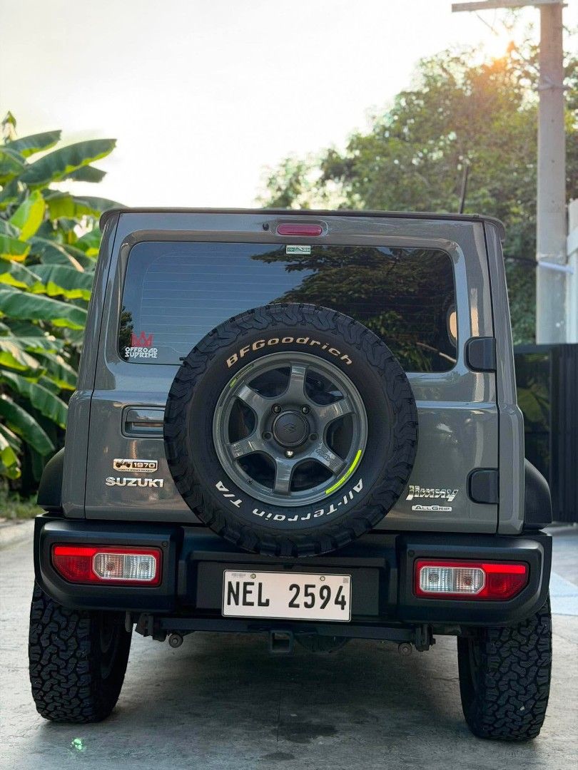 Suzuki Jimny GLX 4x4 Auto (Category: Used Cars) located in Quezon City. Submitted by nyelly01 (Listing ID 1459419459, Image 2). Description: Suzuki Jimny 2021 GLX A/T 4x4 Japan Built 2nd Owner Upgrades: 350k total Orig Japan Rays Gram Lights Mags 5pcs (100k) Wrapped with bnew BFG tires 5pcs yr 2024 (100k) Leather Seats (8k) center rest console (2k) 2-1 color Fog lamps (bright white and fog yellow) Speed sensing locking module (3k) Tow Hitch (15k)
