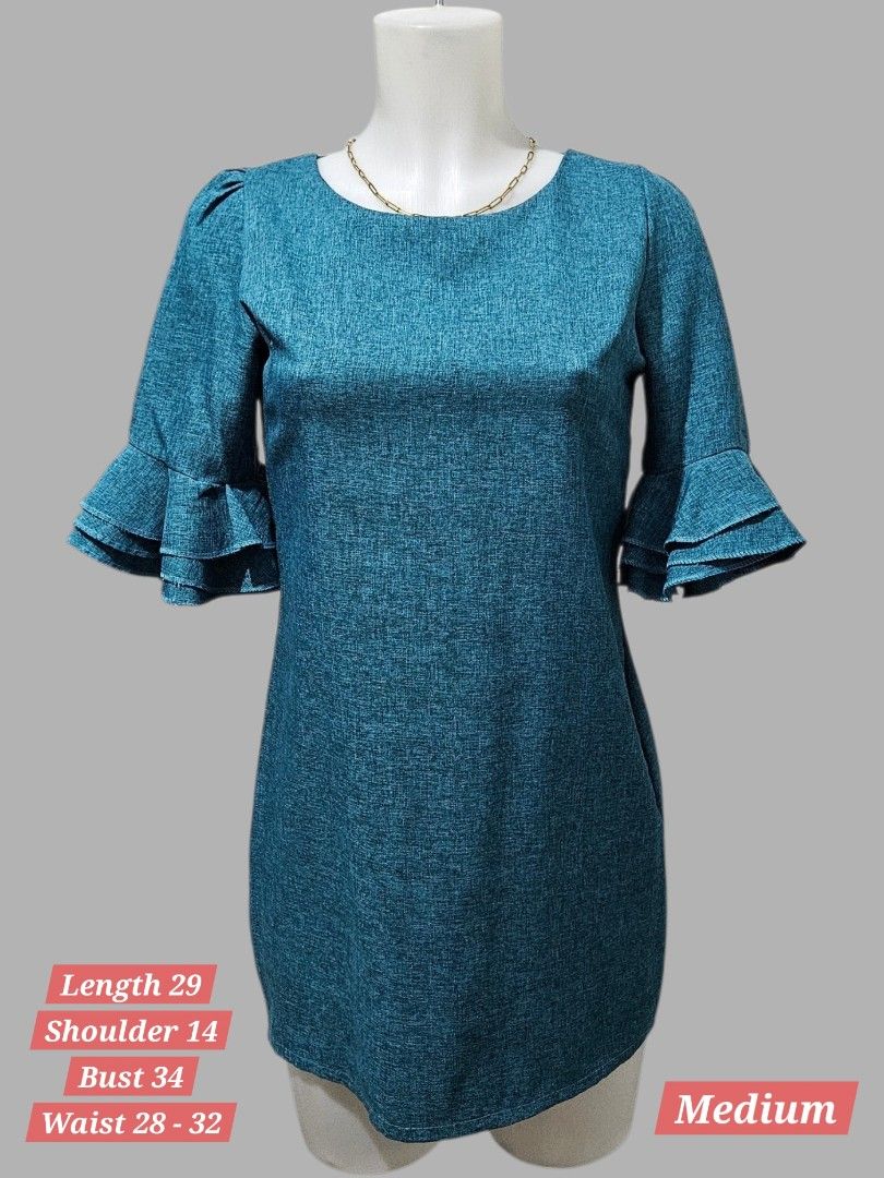 Teal Textured Dress with Ruffle Sleeves (Category: Dresses) located in Quezon City. Submitted by kirstenbella (Listing ID 1459443621, Image 1). Description: - Teal textured dress - Ruffle details on sleeves - Zipper closure at the back - Size: Medium - Like new condition .