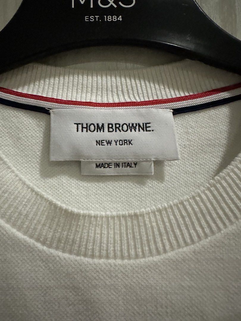 Thom Browne White Short Sleeve (Category: Tshirts & Polo Shirts ) located in Quezon City. Submitted by bqchane (Listing ID 1459320013, Image 2). Description: - Size 38 - Authentic Thom Browne white short sleeve t-shirt - Made in Italy - Signature red, white, and blue stripe detail at the hem - Classic crew neck design - Versatile staple for any wardrobe.