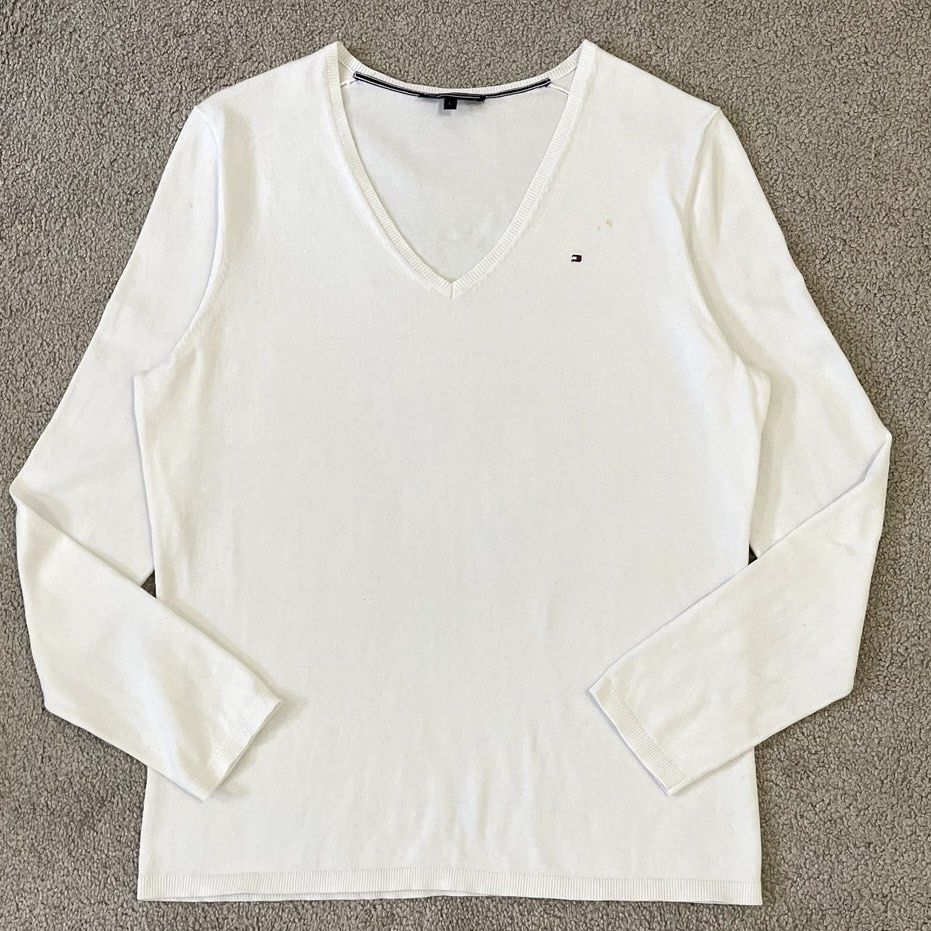Tommy Hilfiger White V-Neck Long Sleeve (Category: Longsleeves) located in Manila. Submitted by oja02 (Listing ID 1459261932, Image 1). Description: Tommy Hilfiger Longsleeve V-neck Color: White Size: Small on tag but can fit up to XL Unisex Brand New. Never worn Super nice in actual Loc: Manila.