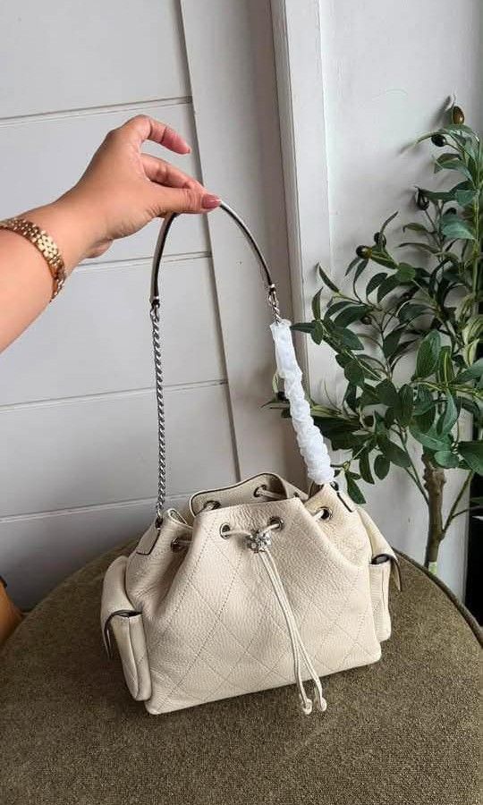 Tory Burch Charlie Quilted Drawstring Bag (Category: Luxury Bags & Wallets) located in Santa Cruz. Submitted by janelovebagswatchesshoesph (Listing ID 1459392837, Image 2). Description: Tory Burch Charlie Quilted Drawstring Bag featuring a polished gold-tone chain shoulder strap..