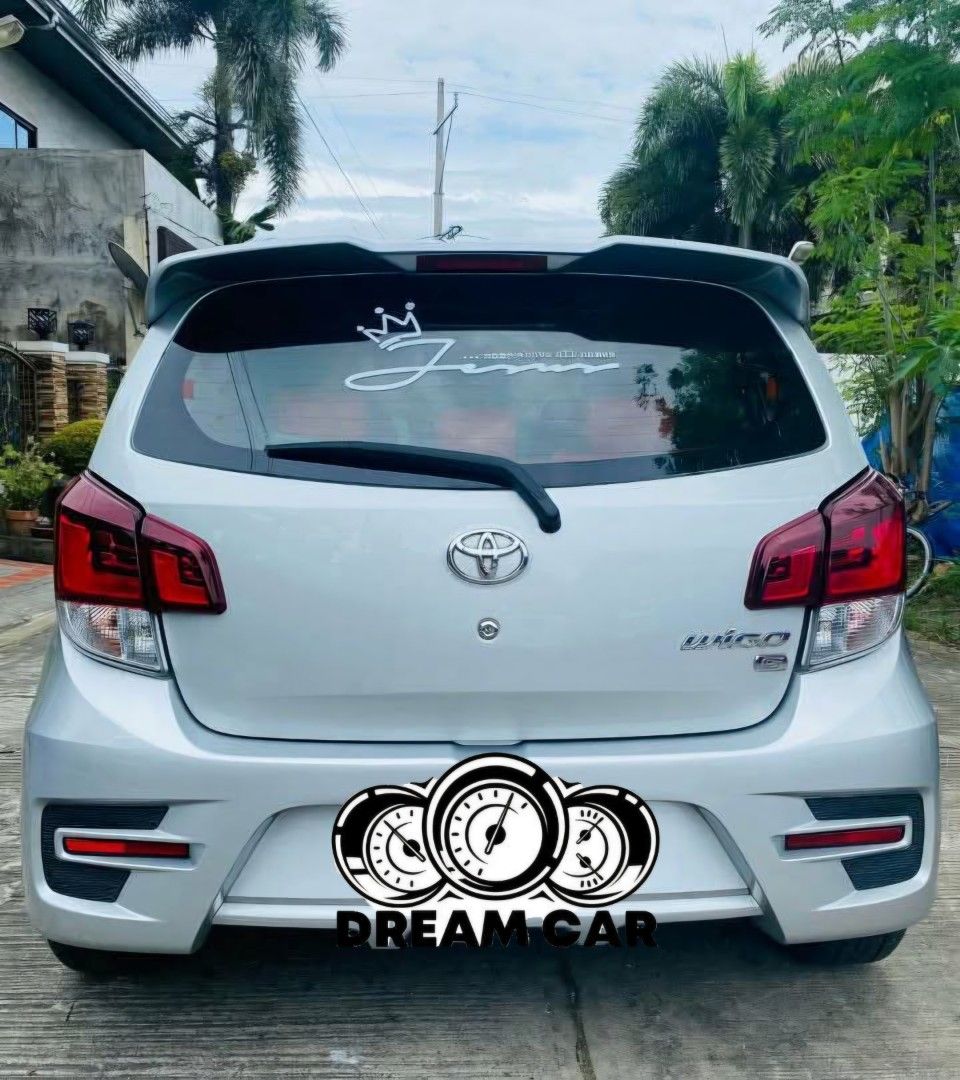 Toyota Wigo (Category: Used Cars) located in Manila. Submitted by strawhatlu60500 (Listing ID 1459305547, Image 2). Description: Wigo G 2018-2019 AT 50k+ mileage Excellent Engine and Trans SUPER lamig aircon Leather seat Naka Mags. Registered until May 2027 Complete papers First owner Issue cosmetics sa hood. Yun lang. Normal sa 2ndhand unit na walang bubong ang parking..