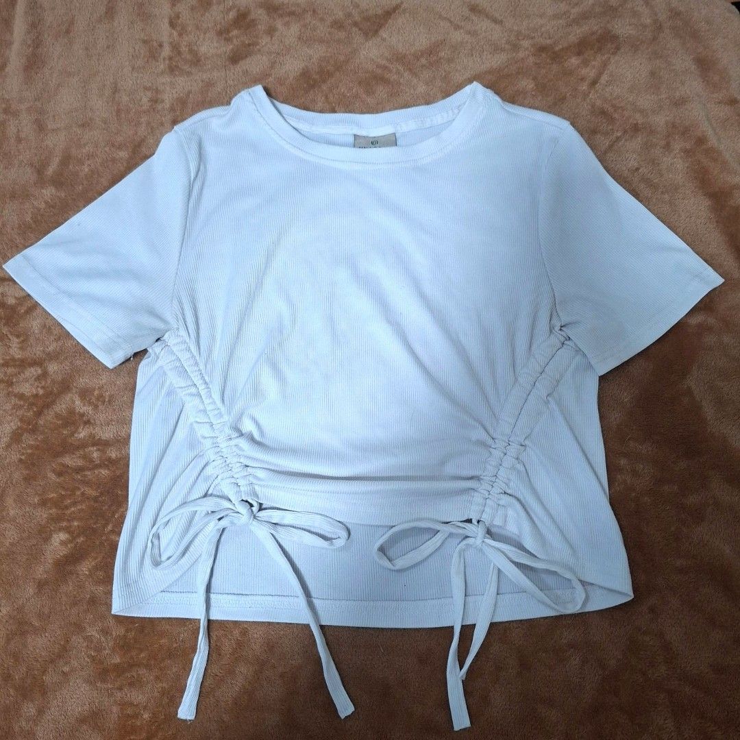 UNAROSA Drawstring Croptop (Category: Shirts) located in Manila. Submitted by ic_itsme (Listing ID 1459325908, Image 1). Description: S on the tag Measurements via measuring tape: - Bust size: 33 inches - Length: 19 inches - Shoulders: 14 inches - Sleeves: 8 inches - Arm hole: 6 inches.