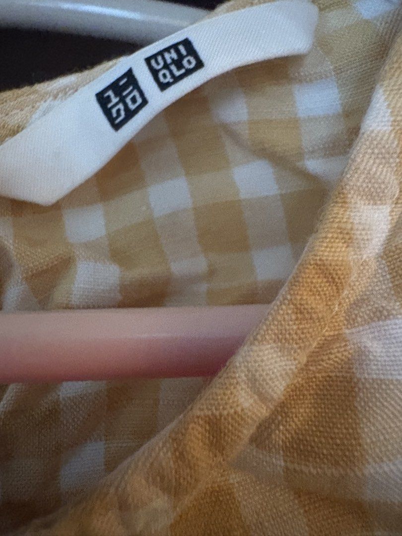 UNIQLO Gingham Sleeveless Top Size S (Category: Sleeveless) located in Muntinlupa City. Submitted by abbeyfelize (Listing ID 1459353977, Image 2). Description: - Yellow and white gingham pattern - Made with a comfortable rayon, linen, and cotton blend - Features a keyhole detail at the back with button closure - Breathable fabric.