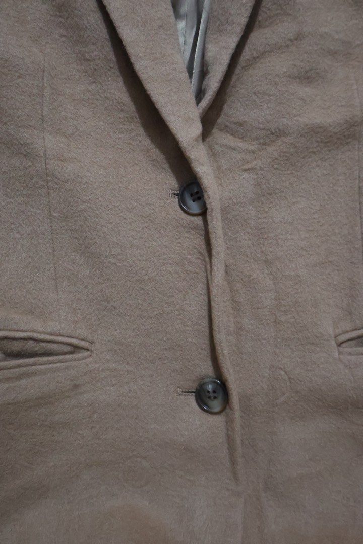 UNIQLO Wool Cashmere Blend Long Coat (Category: Coats, Jackets and Outerwear) located in Quezon City. Submitted by NiniTheExplorer (Listing ID 1459340924, Image 3). Description: - Classic camel long coat from UNIQLO - Made with a warm wool and cashmere blend - Features a single button closure - Two convenient front pockets - Fully lined for a smooth finish - Ideal for layering over any outfit - Perfect for staying cozy in cooler weather.